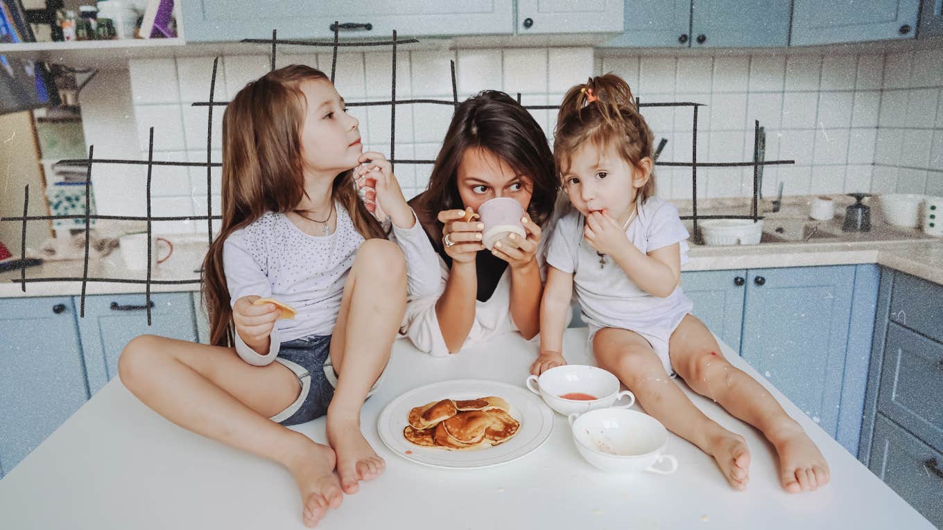 mom and her daughters hanging out in the kitchen