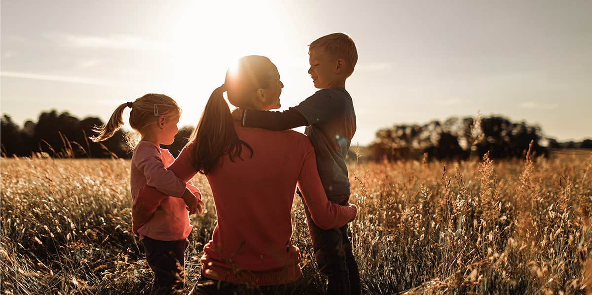 single mom with her two kids in field