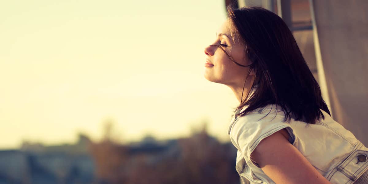 woman looking out the window 