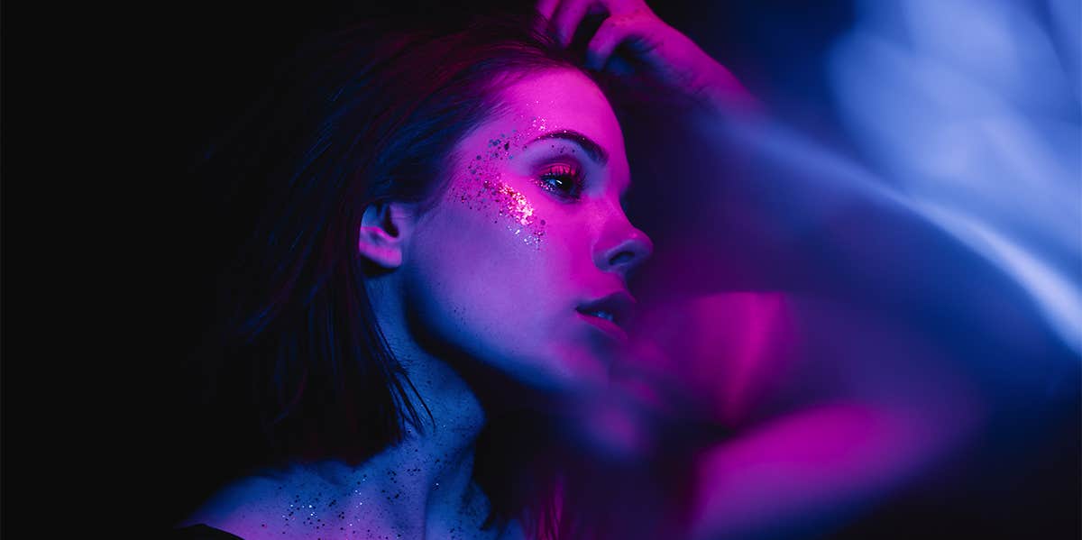 girl in dark room with neon lights