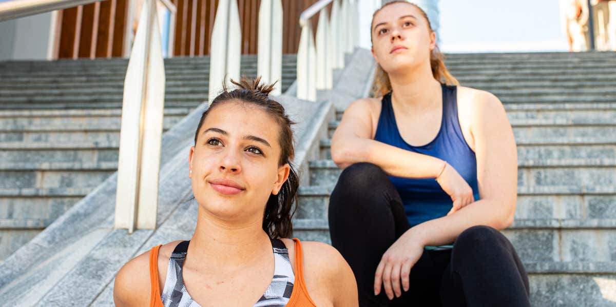 Why Just Because I Say 'I'm Okay' Doesn't Mean I'm Not Hurting women on stairs