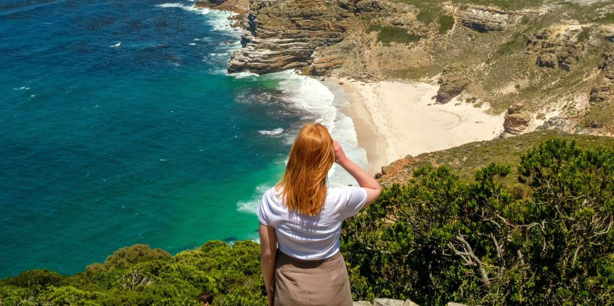 I Would Rather Travel The World Than Ever Have Kids woman overlooking beach