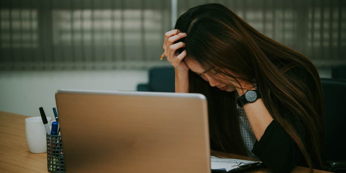 sad woman at laptop