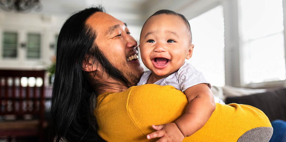 dad holding baby