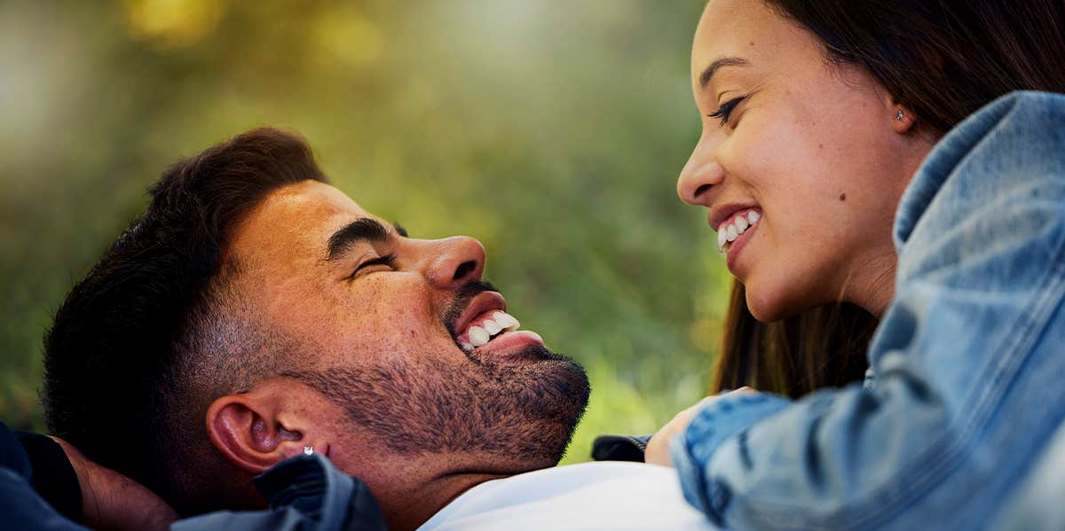 man and woman laughing together
