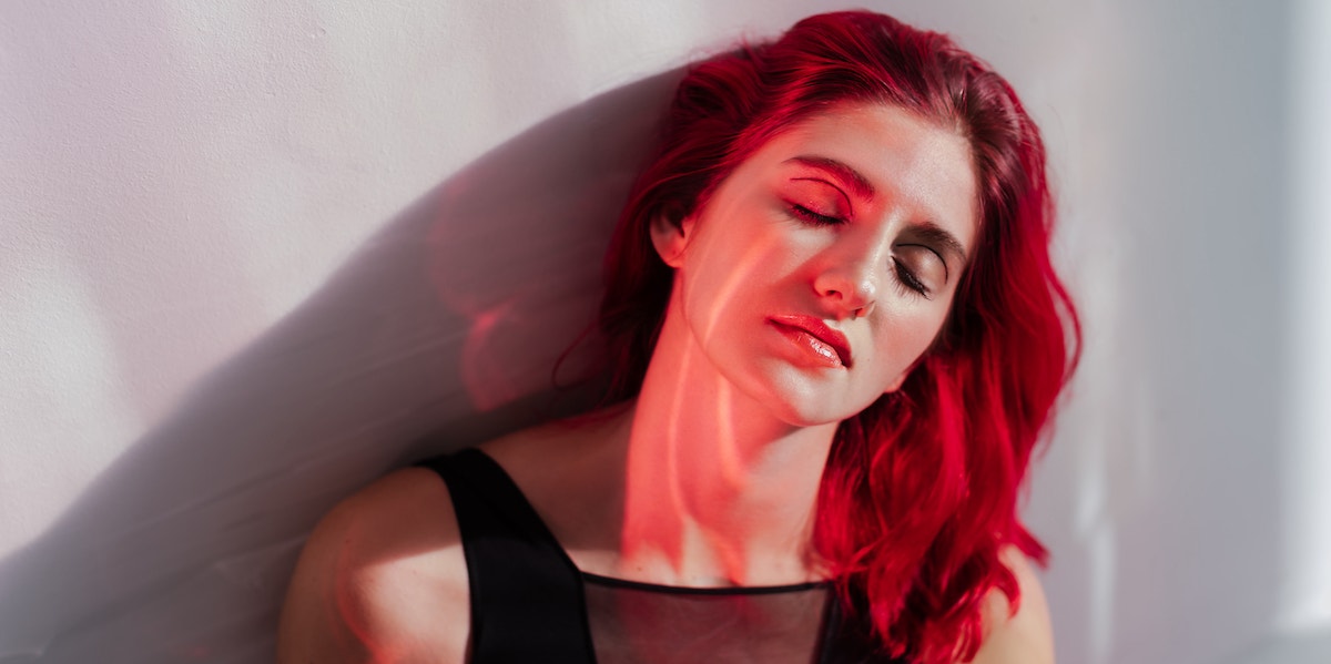 If She Does These Things, She’s An Emotional Psychopath girl with red hair sitting alone
