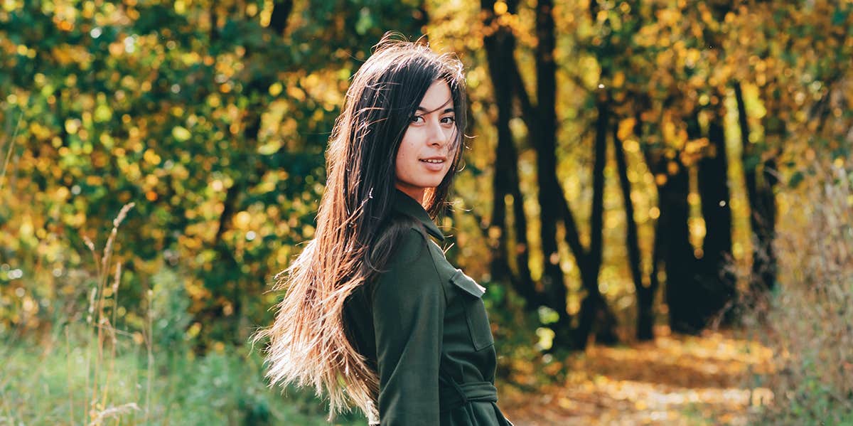 woman walking in forest