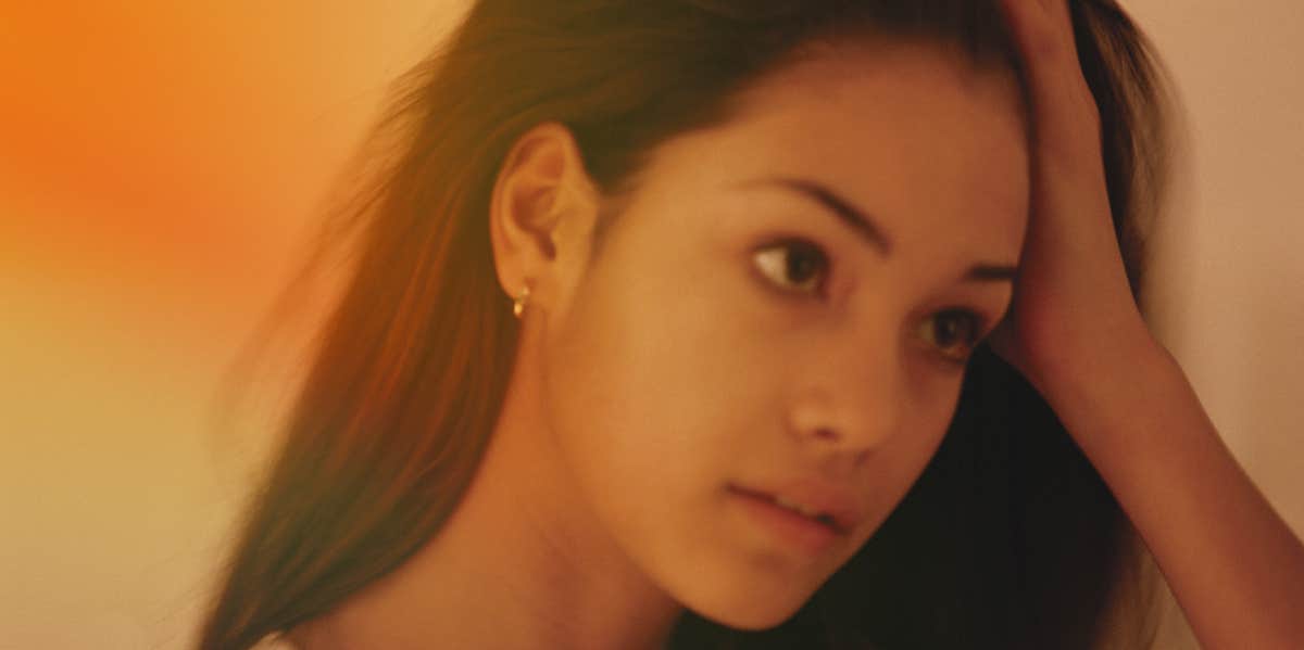 Subtle Signs You Have Serious Trust Issues In Your Relationship worried woman with hand on head