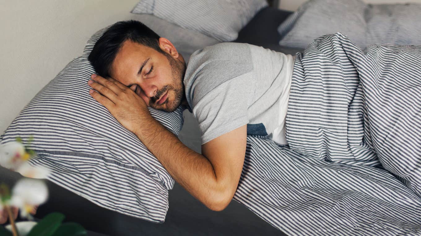 Man sleeping in his bed. 