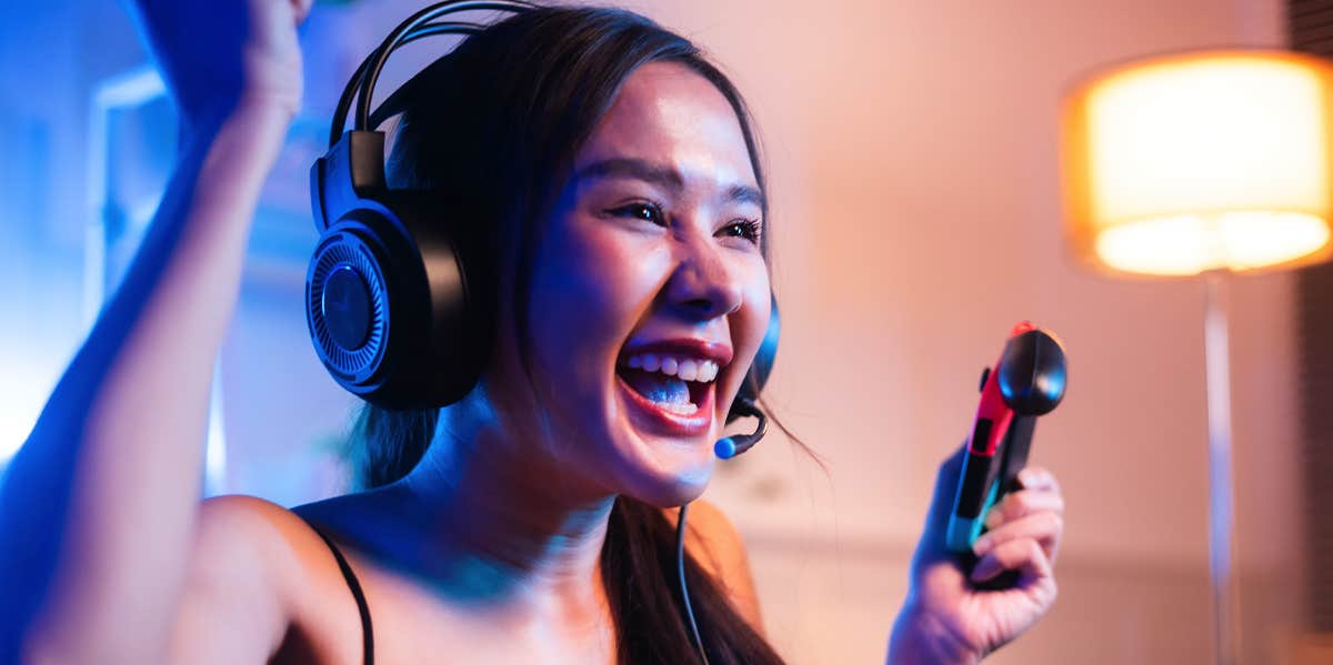 Why People Who Play Video Games Are Smarter & More Successful woman playing video games