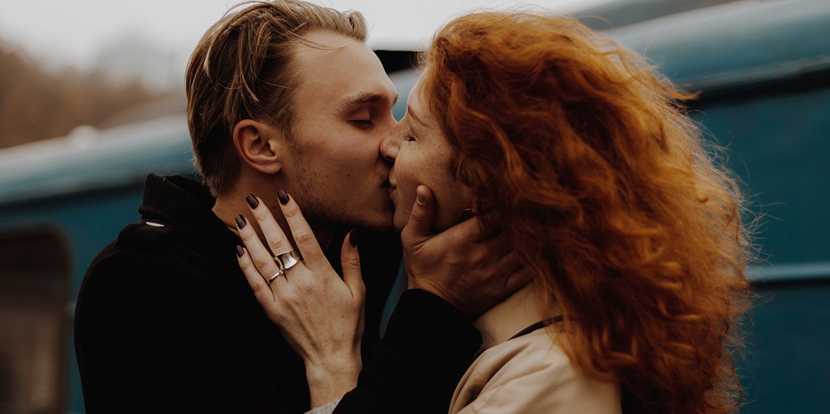 man and woman kissing