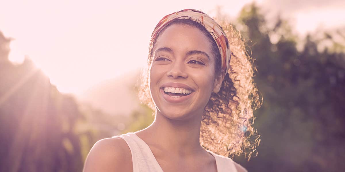 woman smiling in sunshine