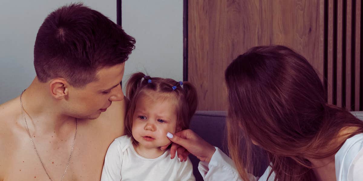 parents comforting child