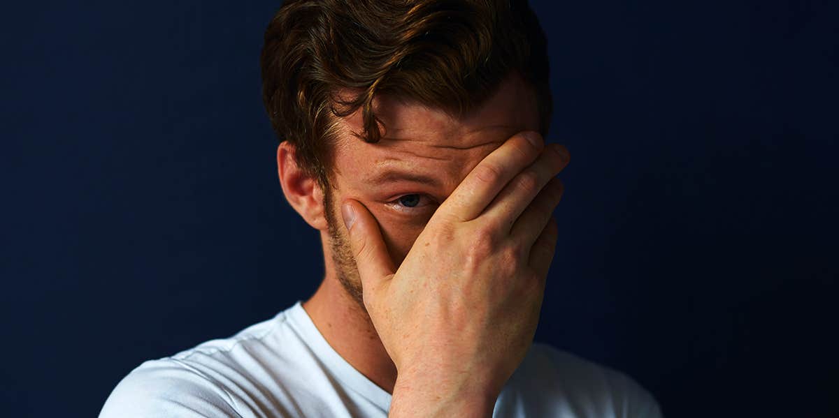 Signs Your Husband Isn't Sure Of Himself shy man covering face