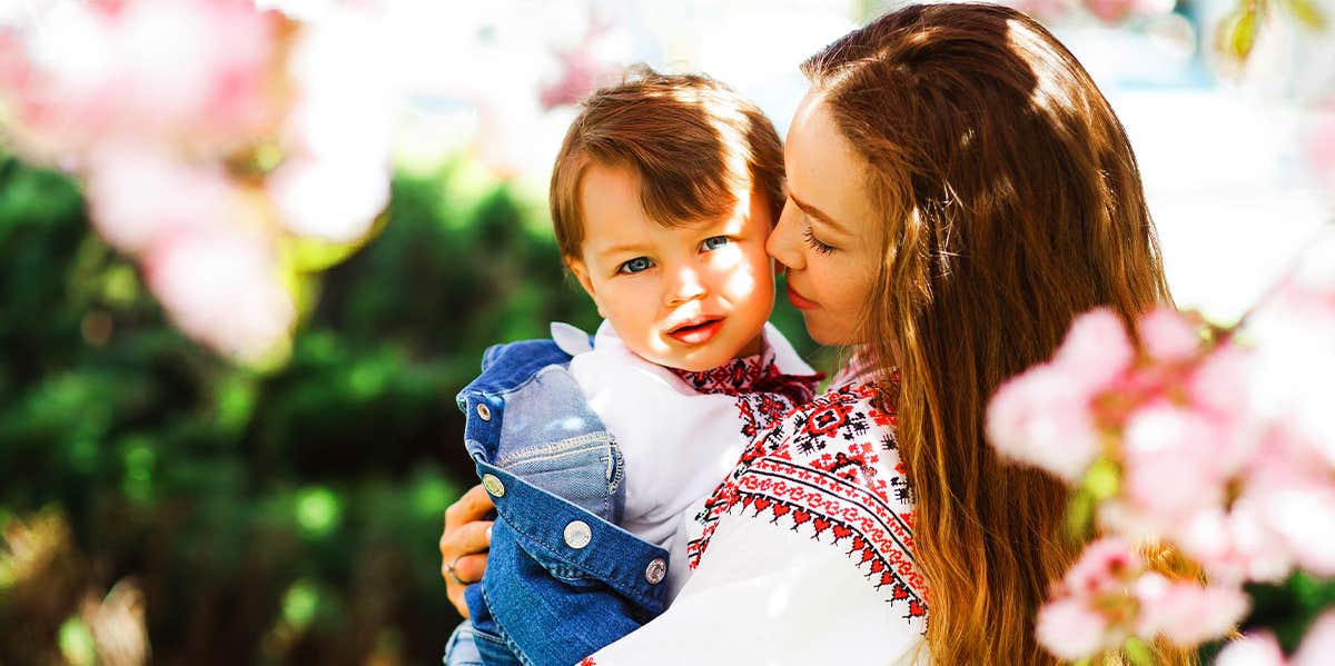 mom holding young son