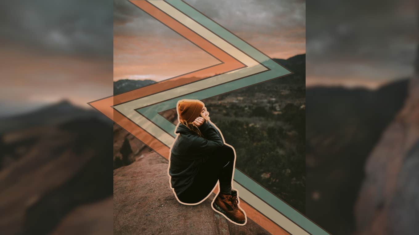 Woman reflecting on mountain top