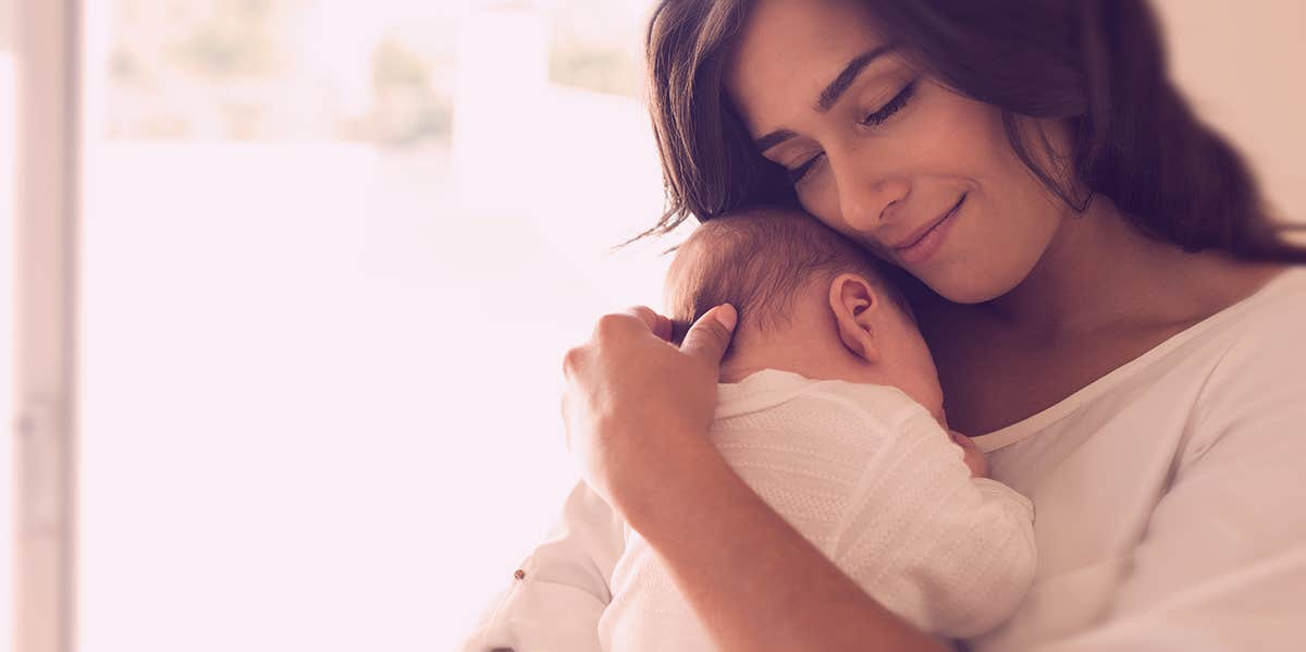 mom hugging baby