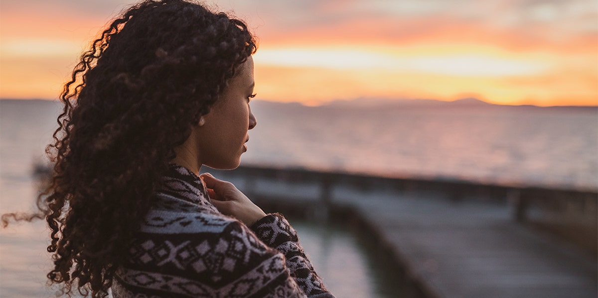 woman looking at sunset