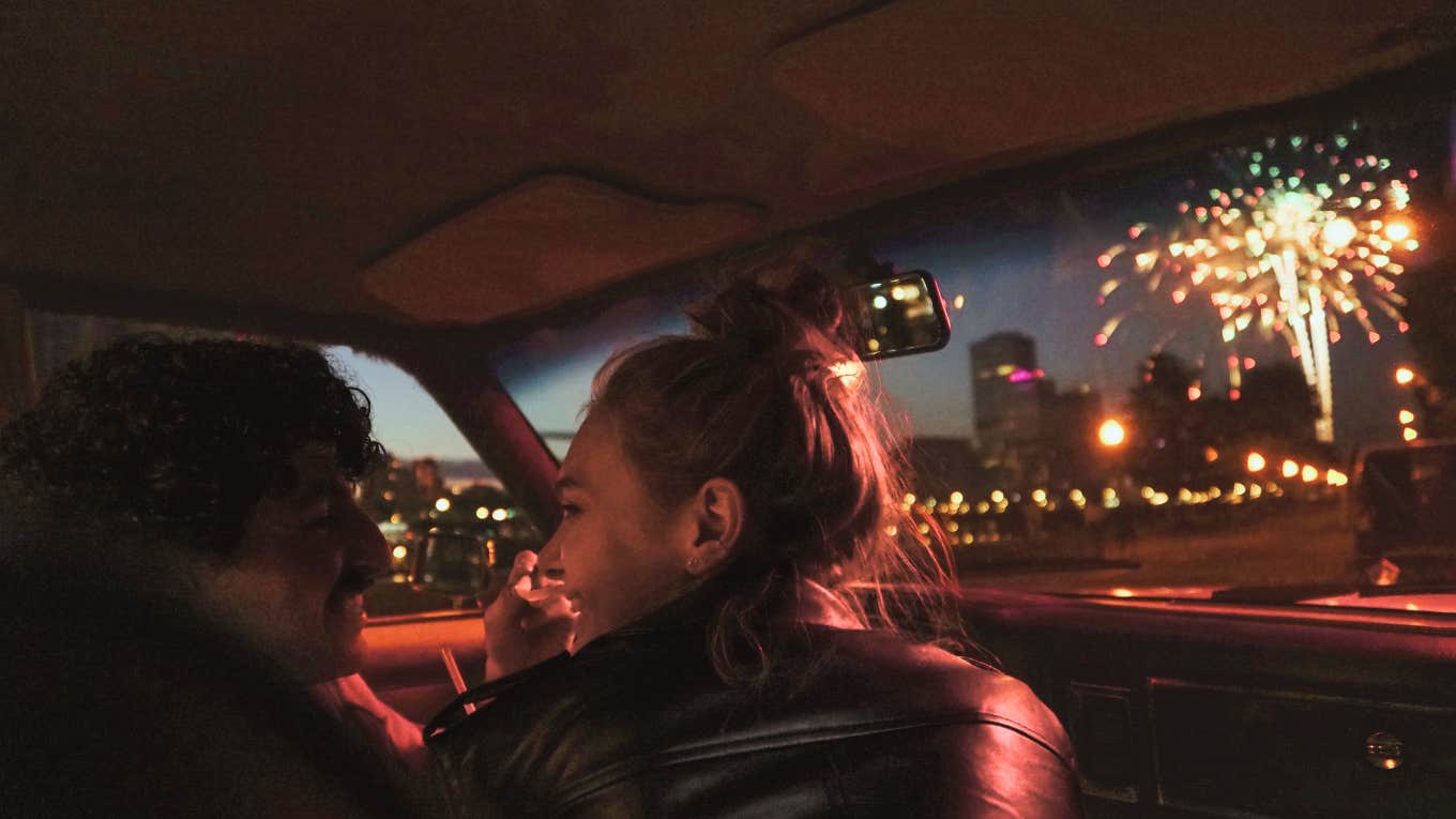 Couple in car watching fireworks 