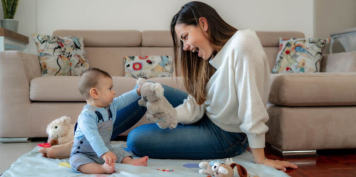 mom playing with baby