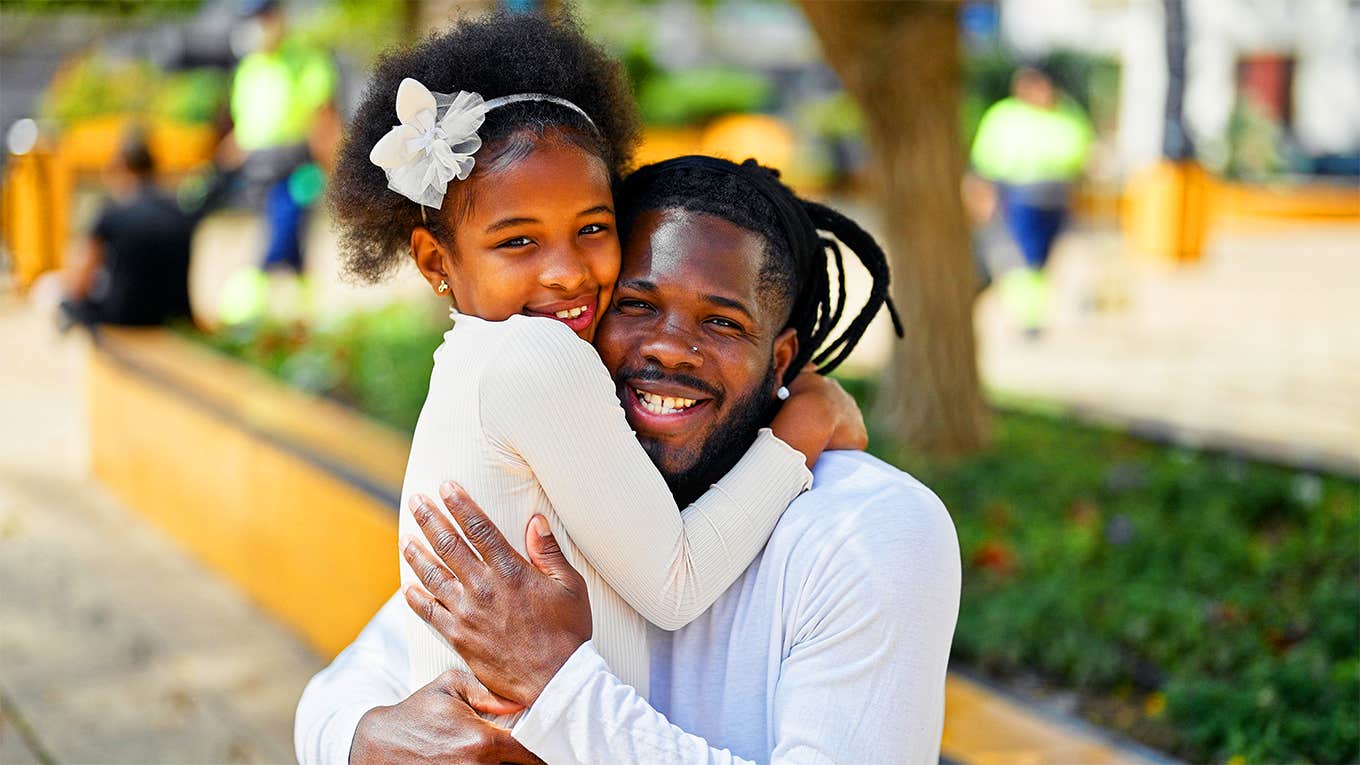 daughter hugging dad