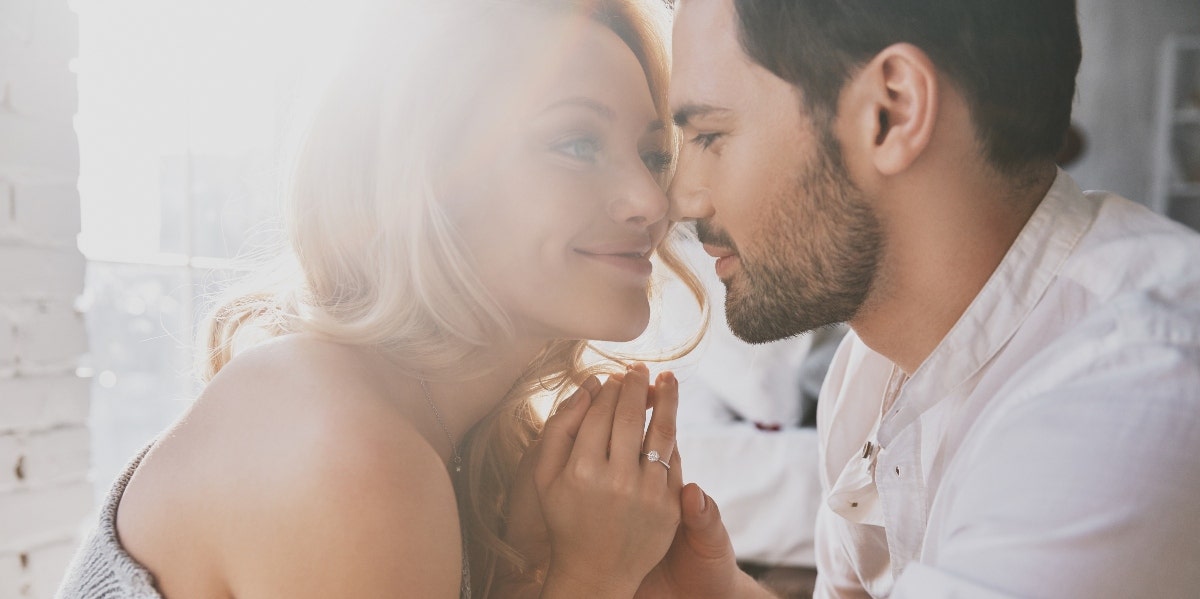 do you need to be in love to have a healthy marriage? couple kissing and embracing