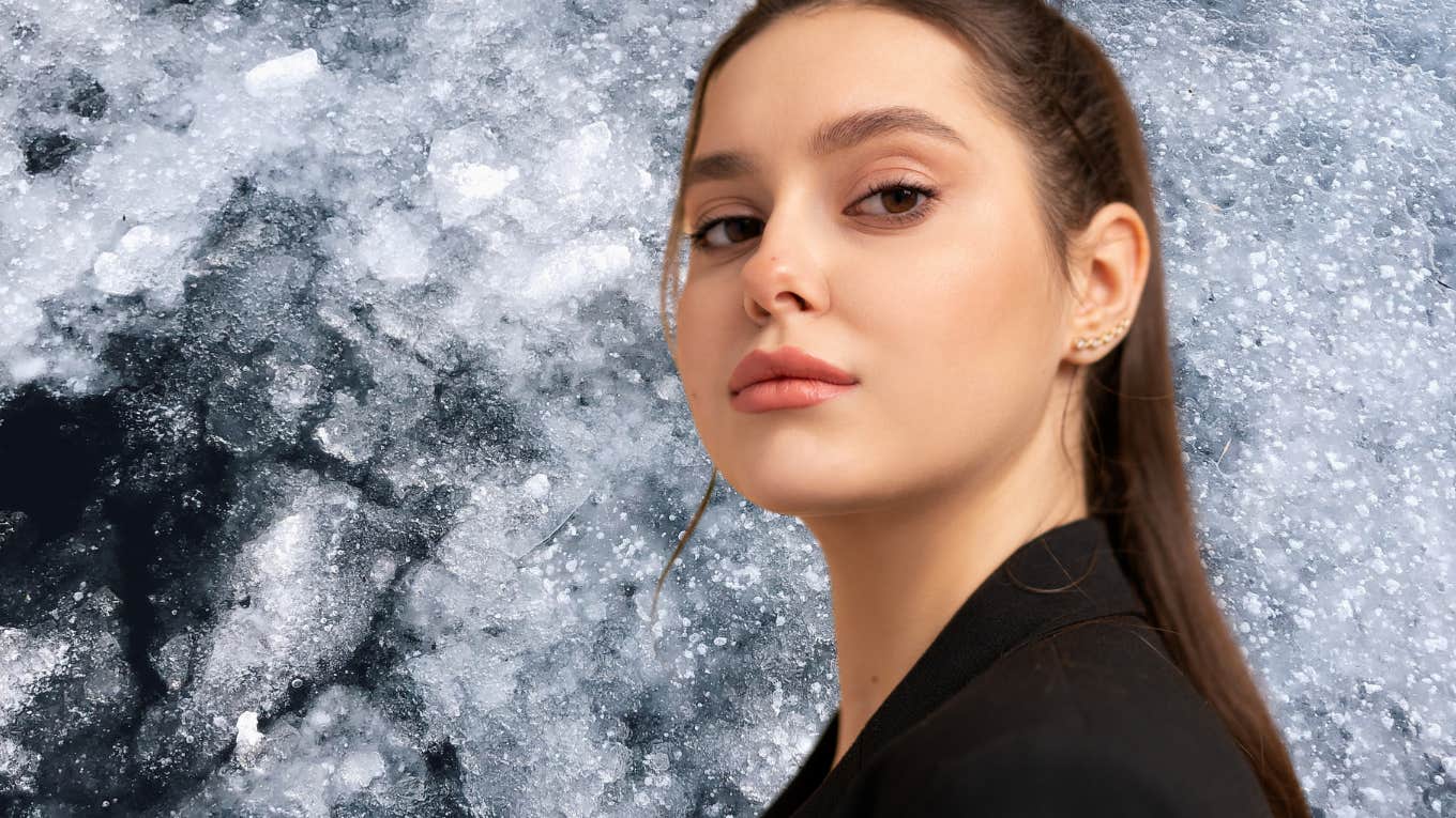 beautiful woman in front of a sheet of ice