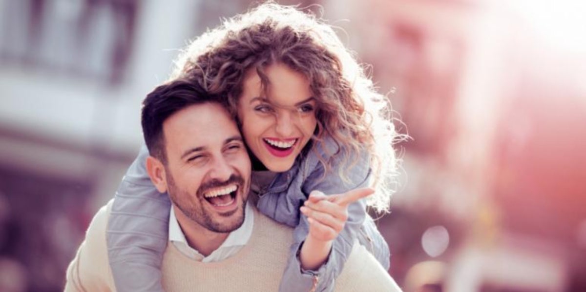 couple embracing piggyback