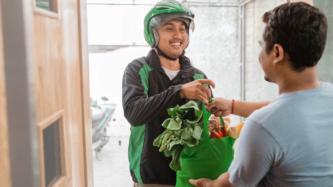 Instacart shopper delivering groceries. 