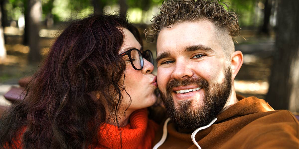 woman kissing man