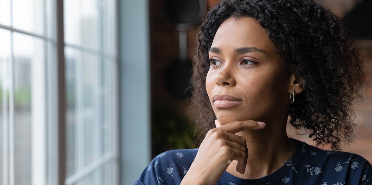 woman staring out the window