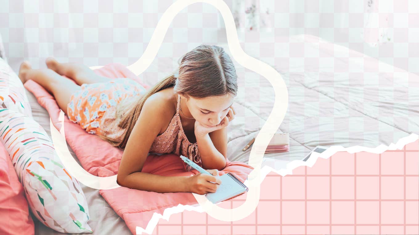 If Your Kid Shows These 7 Behaviors, They're Totally An Introvert little girl on bed alone, coloring