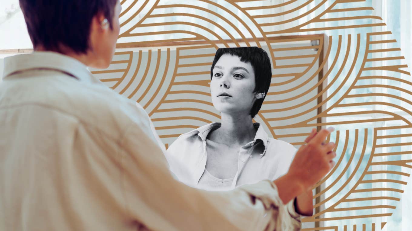 The Invisible Symptoms Of Domestic Abuse That Stay Long After You Have Left Woman looking at herself in mirror