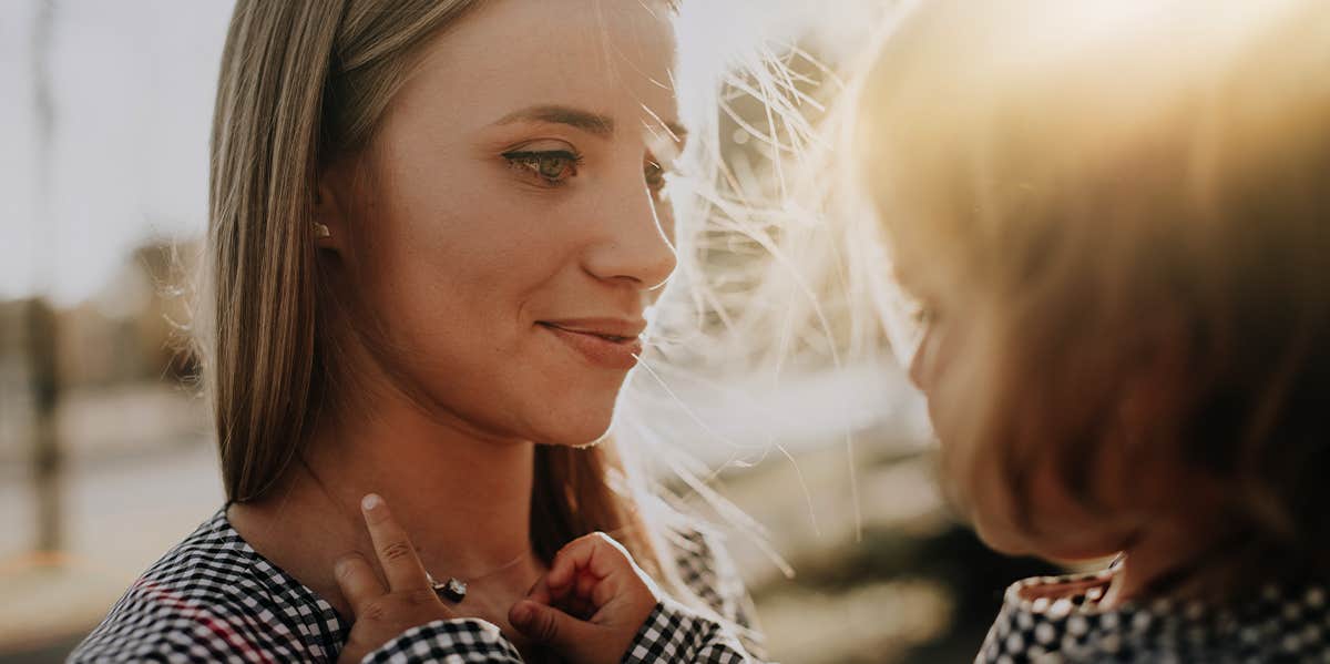 Attachment Parenting Made Me Feel Like An Absolute Failure mother holding young daughter