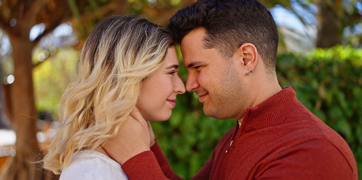 husband and wife embracing face to face