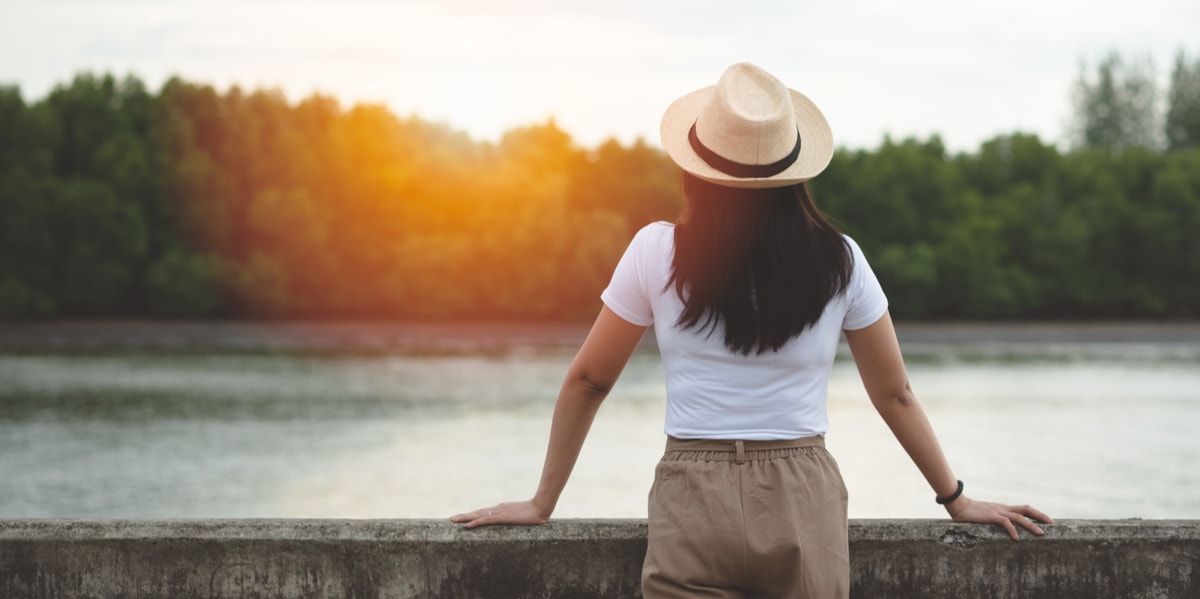 woman looking out at lake