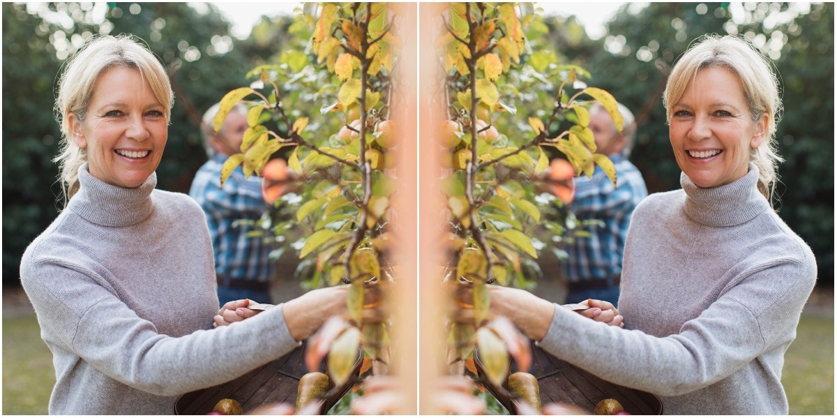 older woman picking fruit