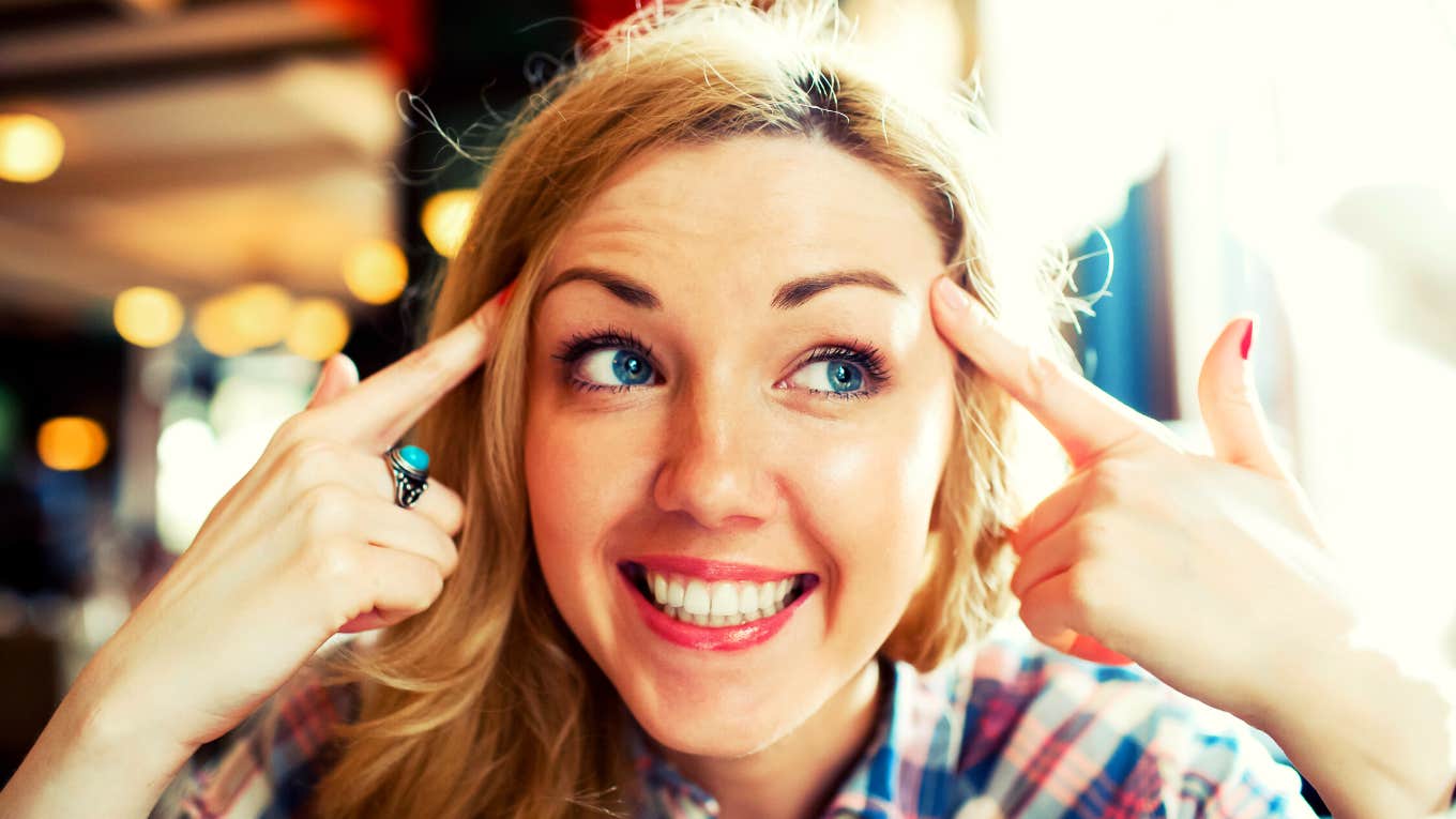 Close up portrait of young smart successful female smiling