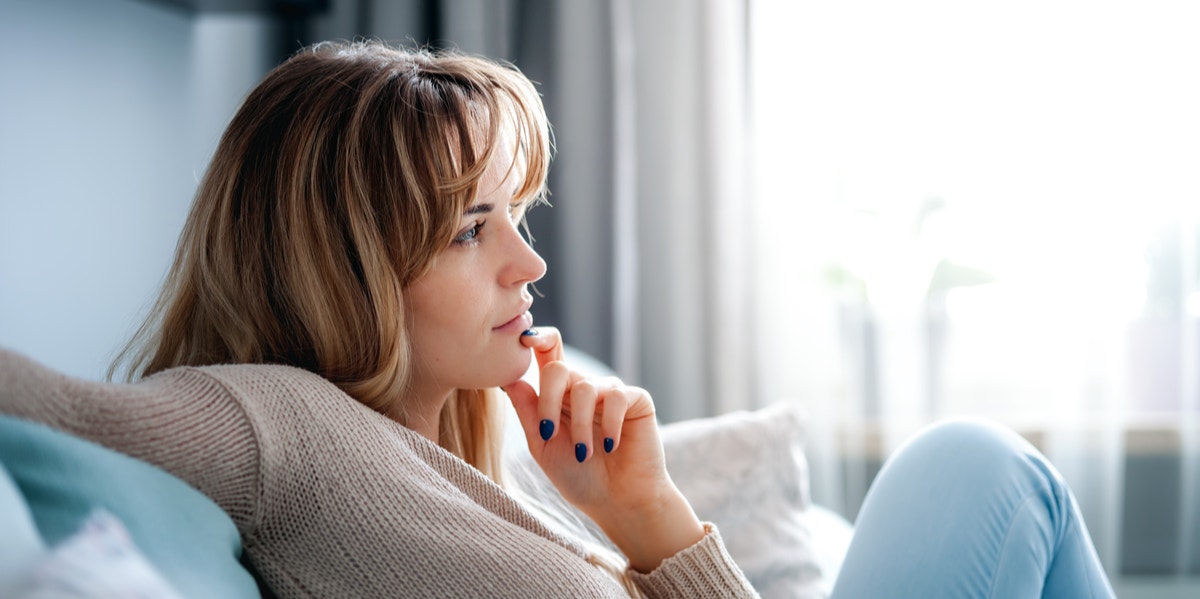 woman sitting on couch