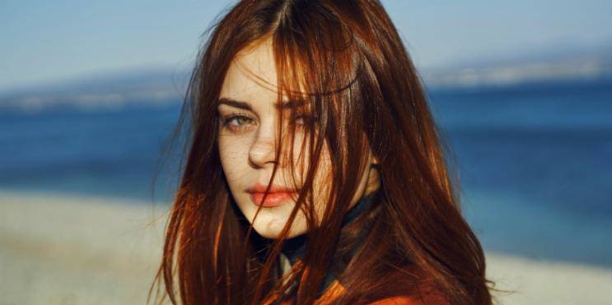 redhead woman on beach