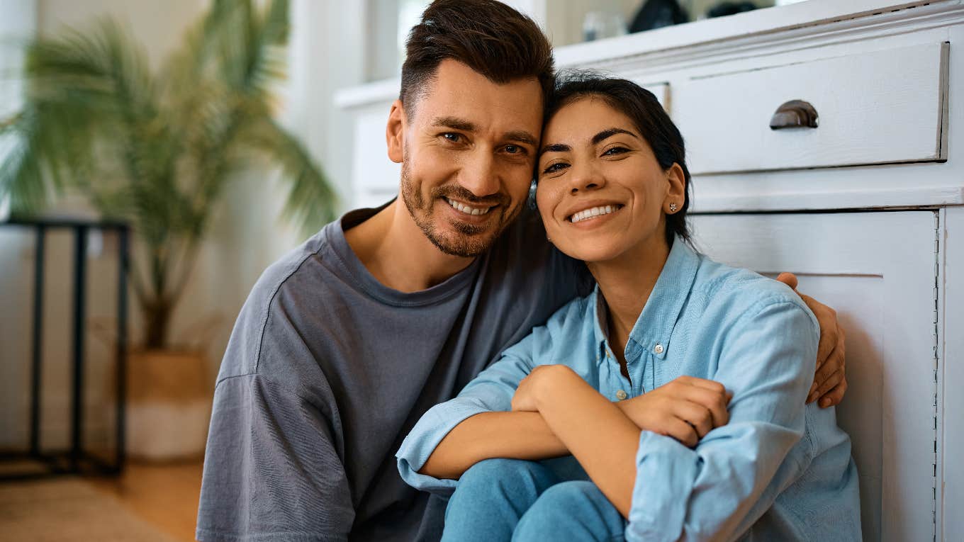 happy smiling couple in kitchen