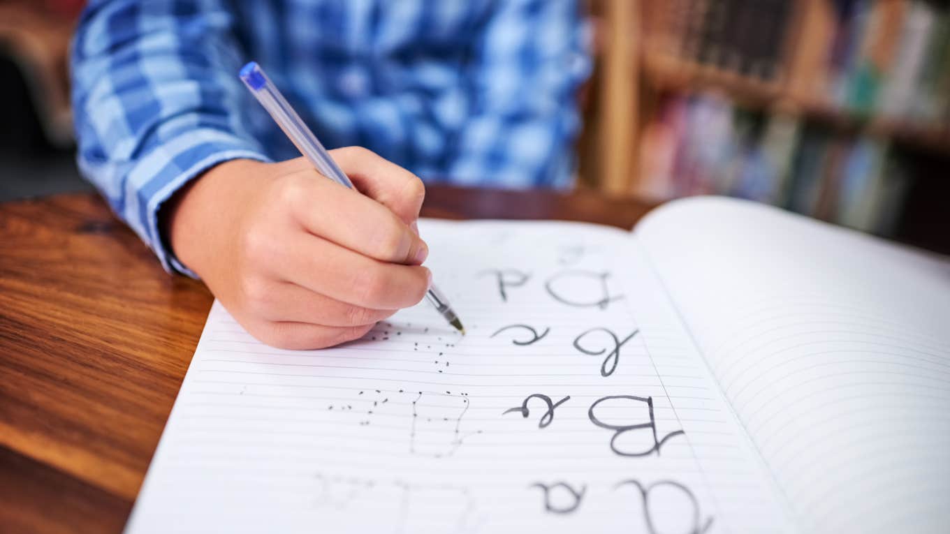 child practicing handwriting