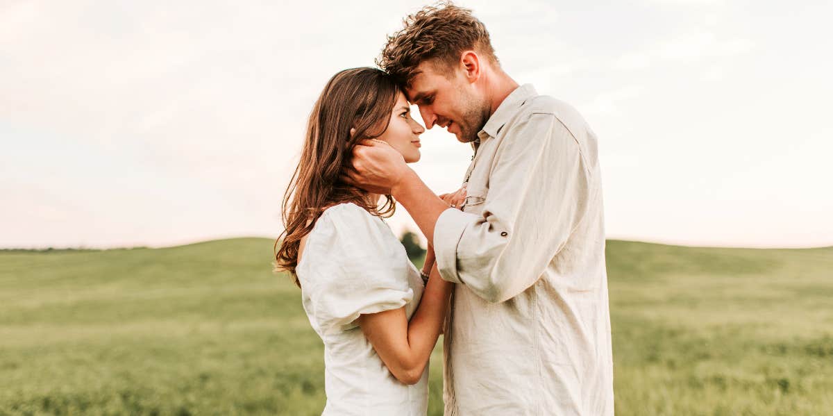 woman about to kiss man