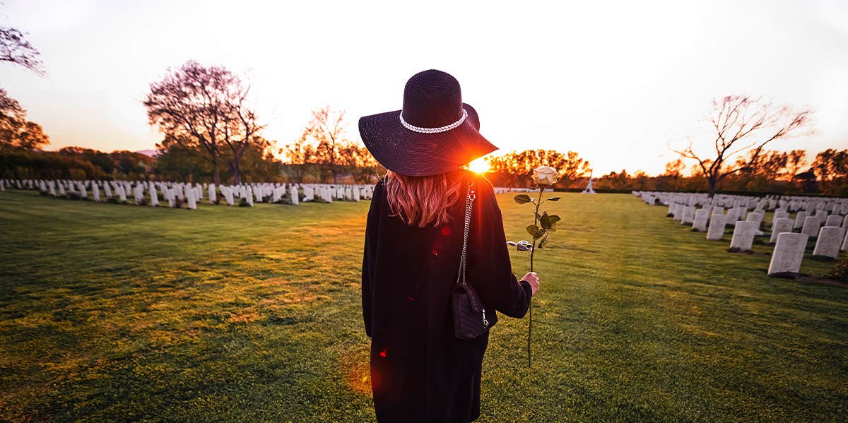 woman walking in cemetery