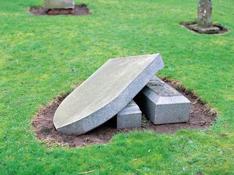 knocked down tombstone