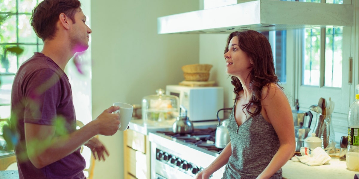 lack of communication in a relationship man and woman talking in a kitchen