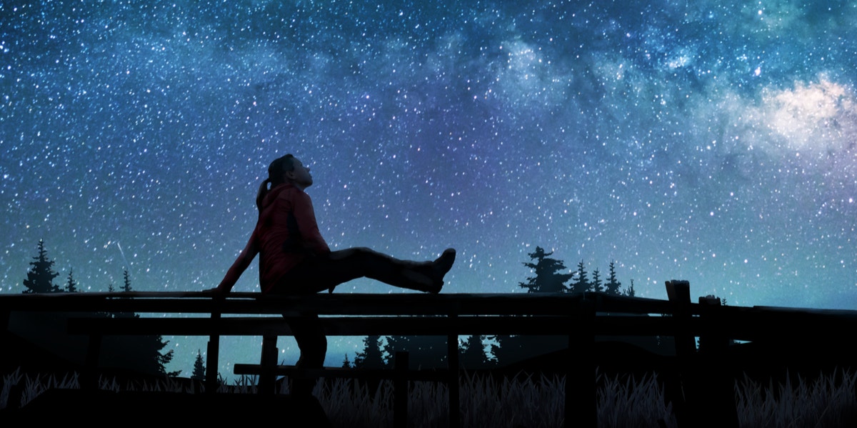 woman looking at stars
