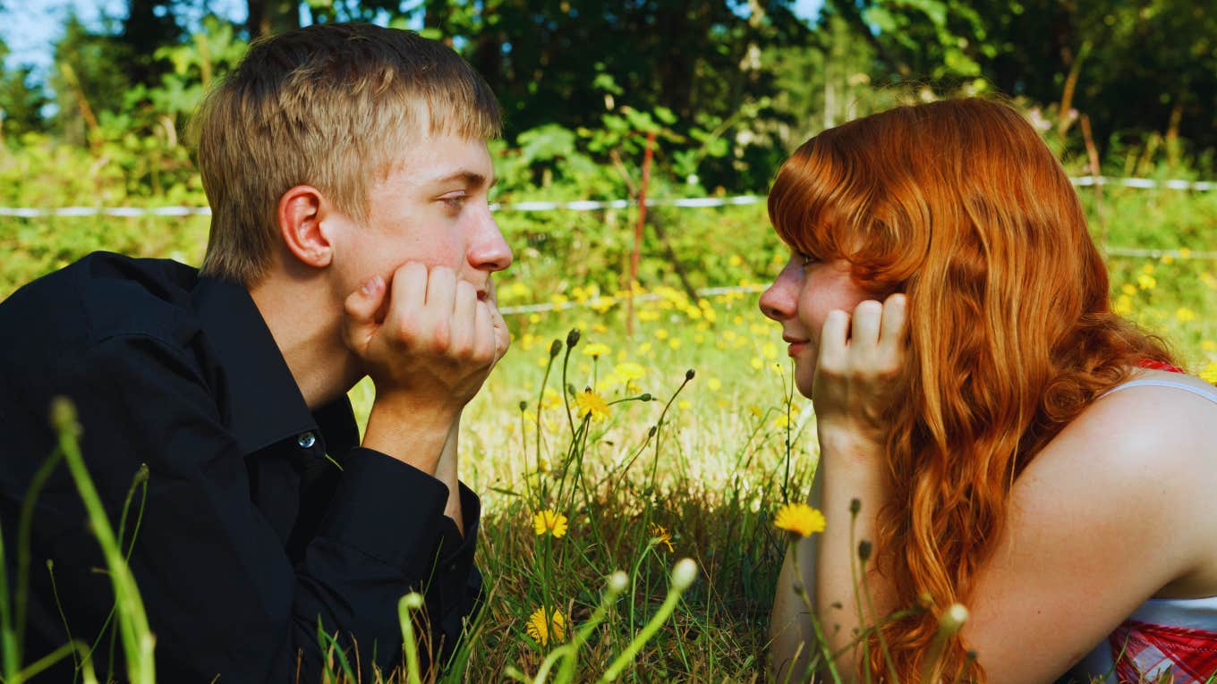 couple laying in grass