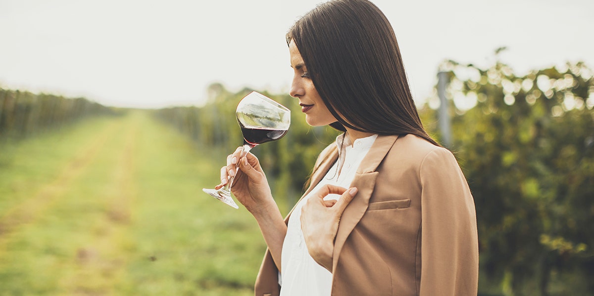 woman by herself in vineyard