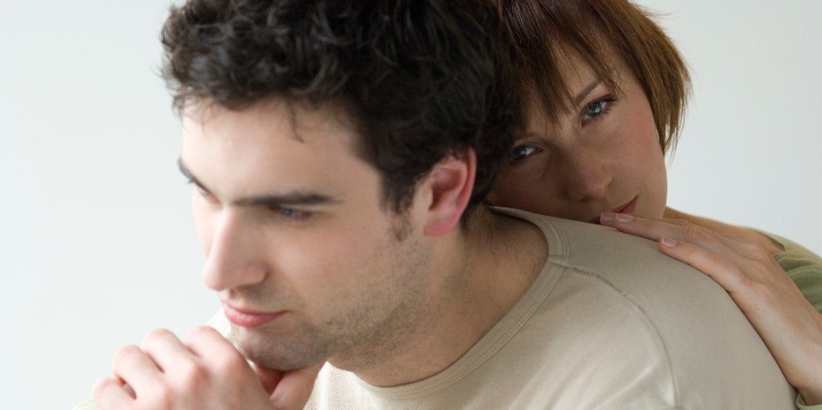 man contemplating with woman behind him